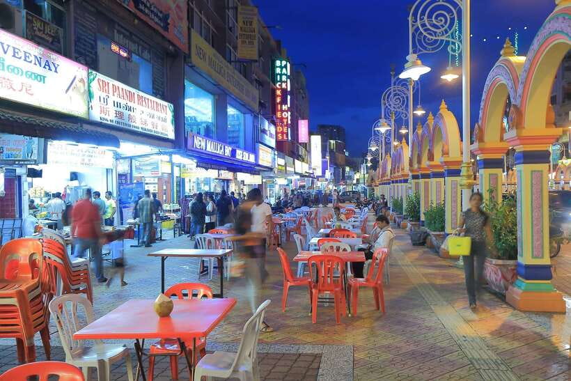 Kuala Lumpur by Night and Malaysian Food Tour - Petaling Street after dark: narrow lanes, street stalls, and bargain mindset