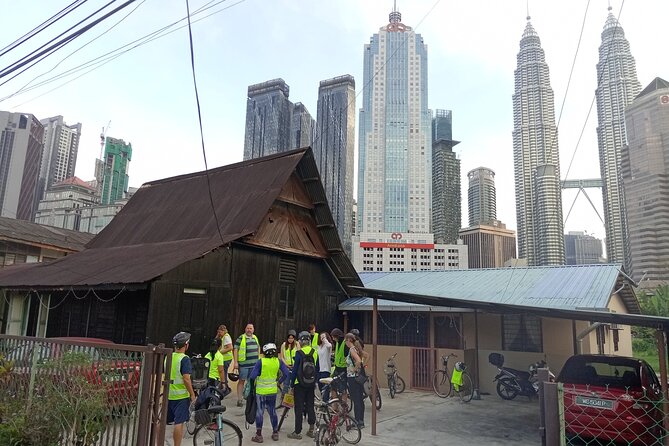 Kuala Lumpur Sunset Evening Cycling Tour - Petaling Street Market: lights, murals, and alleyway KL